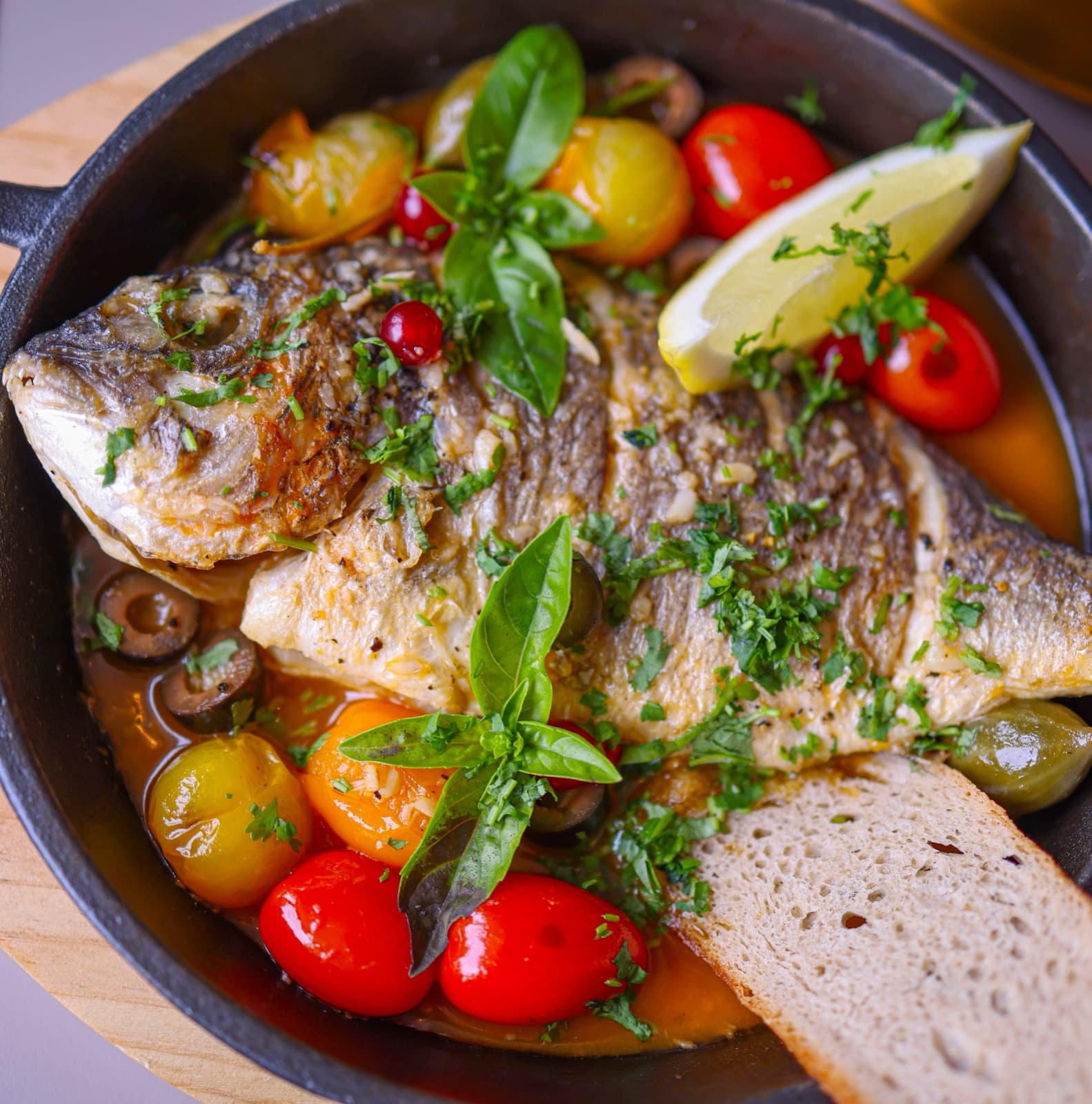 Mediterranean fish with vegetables and olive oil